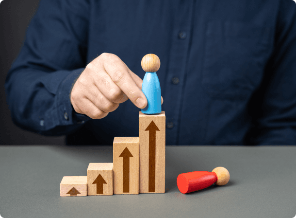 Wooden blocks with upward arrows representing business growth